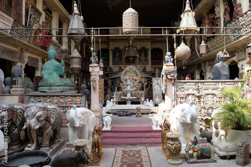 Shop selling Indian antiques and reproductions among a plethora of shops for tourists in Jaipur, Rajasthan, India