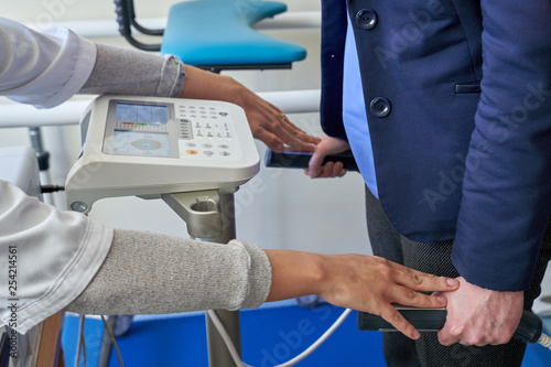 Close up of woman smart Body Composition Analysis by doctor before Fitness Activity. Woman Checking body with Body Composition Analysis machine. weight loss