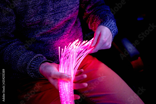 man in color therapy in the retirement care home. multi sensory stimulating room