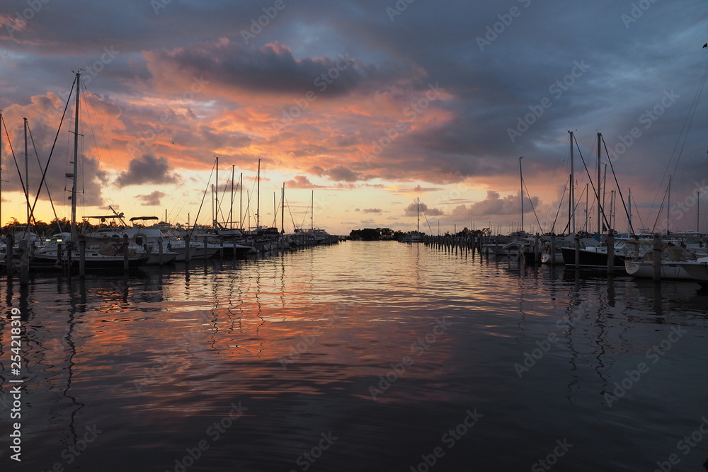 Colorful sunrise after a rainstorm over Dinner Key Marina in Coconut Grove, Miami, Florida.