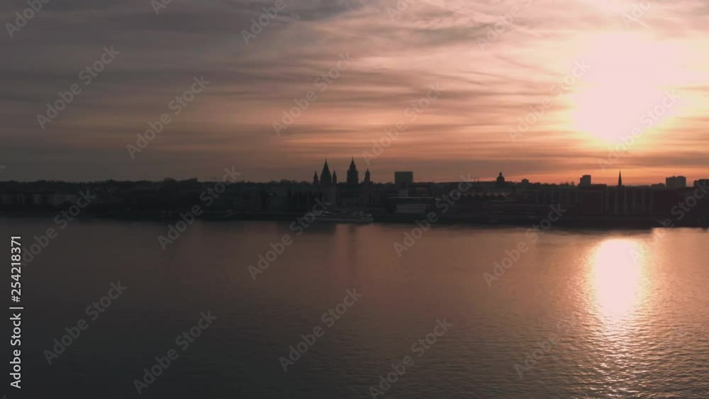 Rhine river aerial view during sunset.Drone is flying towards the city. Rhine river aerial view during sunset.Drone is flying towards the city.