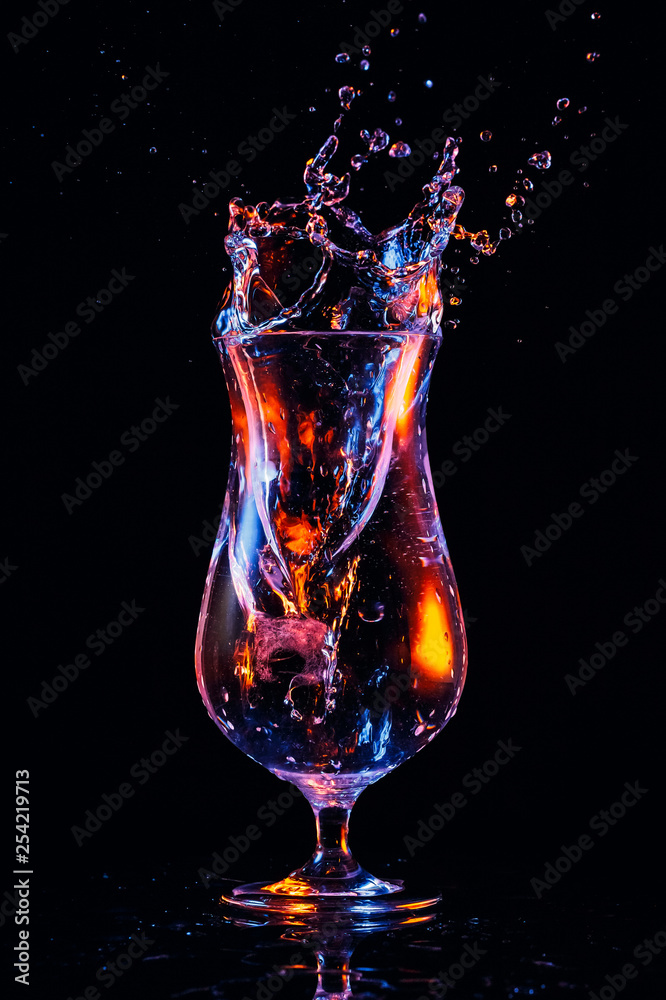 Water splash in a cocktail glass Water splash in a cocktail glass