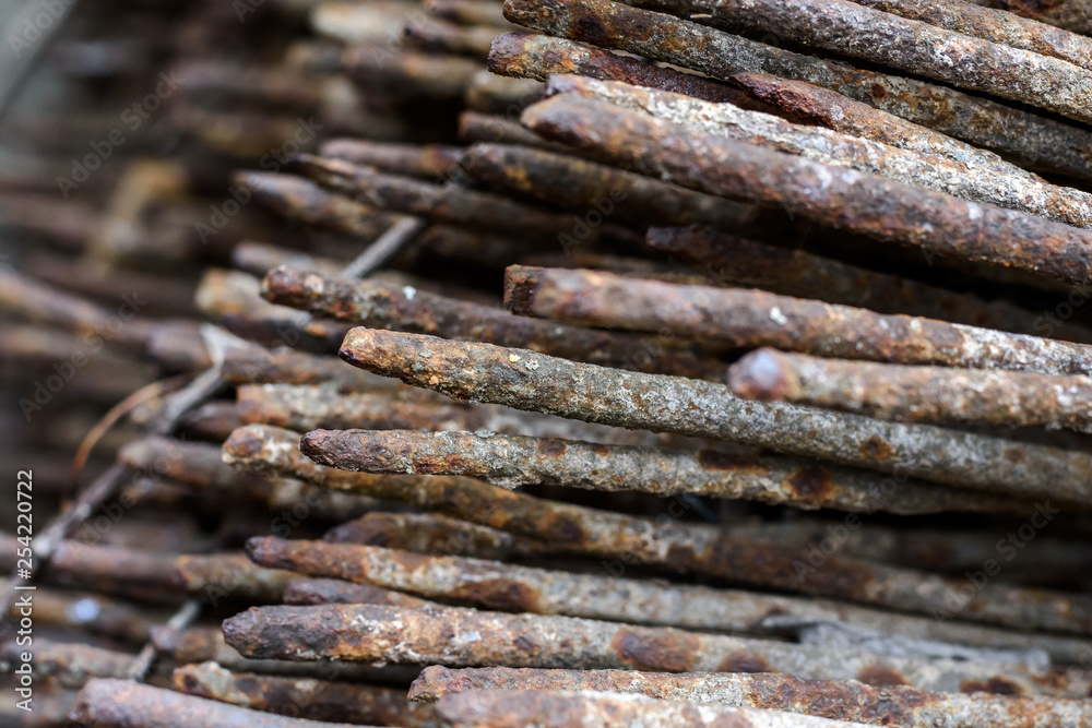 Close up of a large cluster of steel rods intended for use at a construction site. 