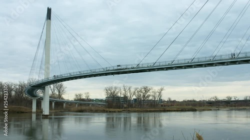 Suspension Pedestrian Bridge Over River photo