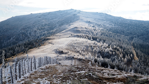 fence to the summit in a dreamy winter landscape