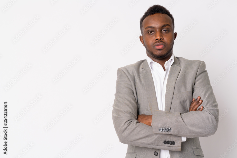 Portrait of young African businessman in suit with arms crossed Portrait of young African businessman in suit with arms crossed