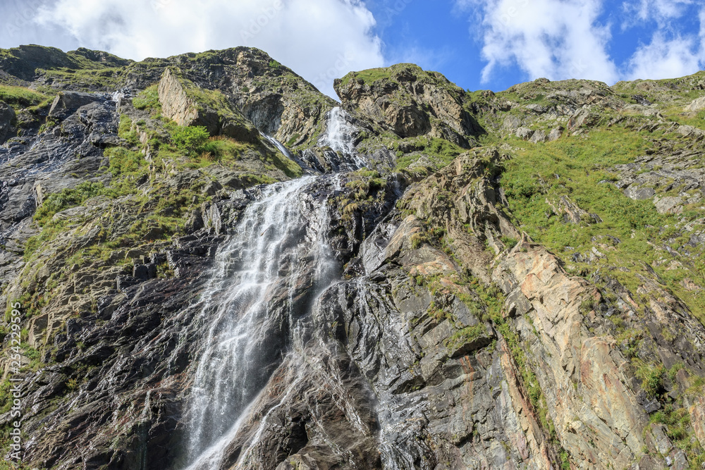 Panorama view of waterfall scene in mountains, national park of Dombay, Caucasus Panorama view of waterfall scene in mountains, national park of Dombay, Caucasus