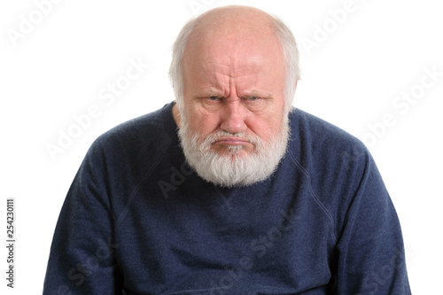 grumpy oldfart or dissatisfied displeased old man isolated portrait photo