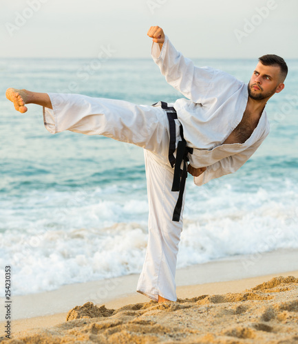 Young man is training kick