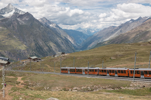 Gornergrat train with tourist is going to Matterhorn mountain