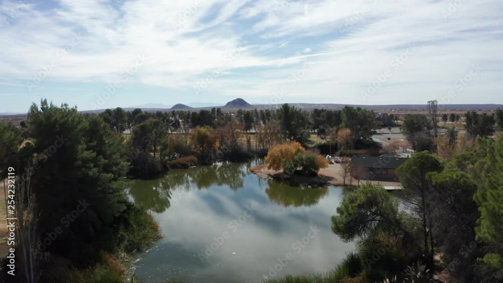 Aerial rising reveal of lake in middle of nowhere, surrounded by Mojave Desert Aerial rising reveal of lake in middle of nowhere, surrounded by Mojave Desert