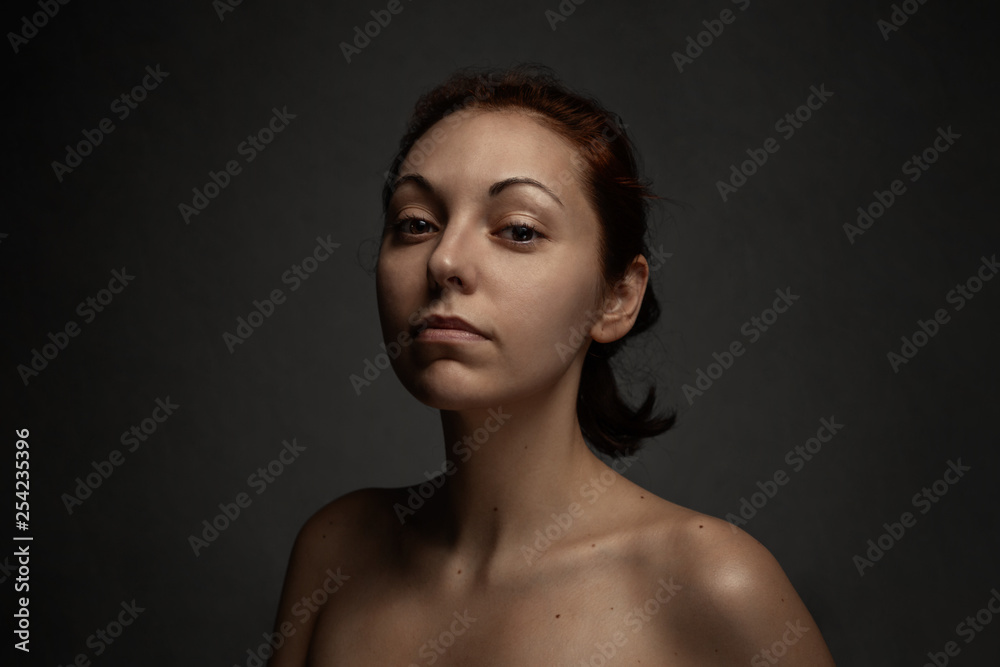Portrait Of Tan Nude Woman Proudly Looks On A Camera Dark Background Portrait Of Tan Nude Woman Proudly Looks On A Camera Dark Background