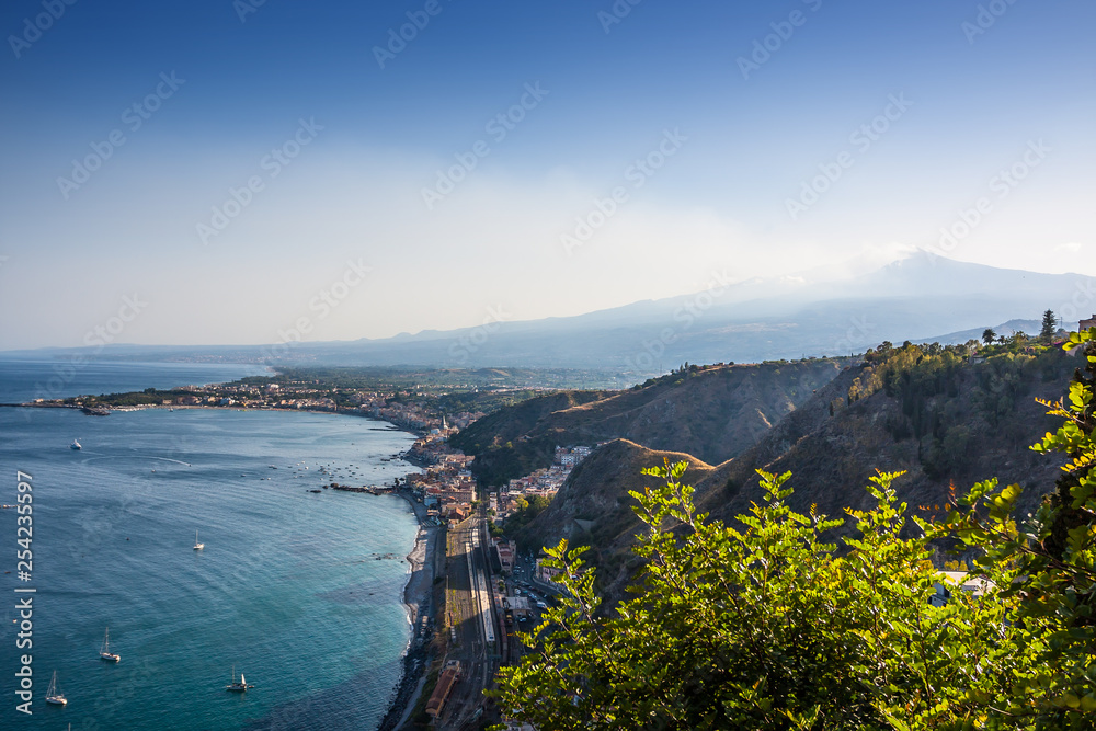 The famous view of Etna volcano from historical city Taormina, Sicily