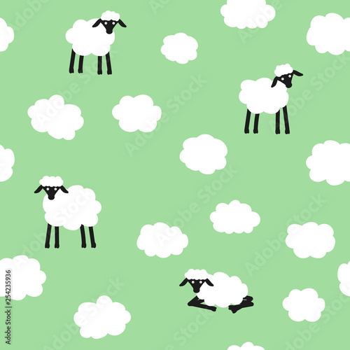 Cute seamless vector pattern. Clouds and sheeps on green background