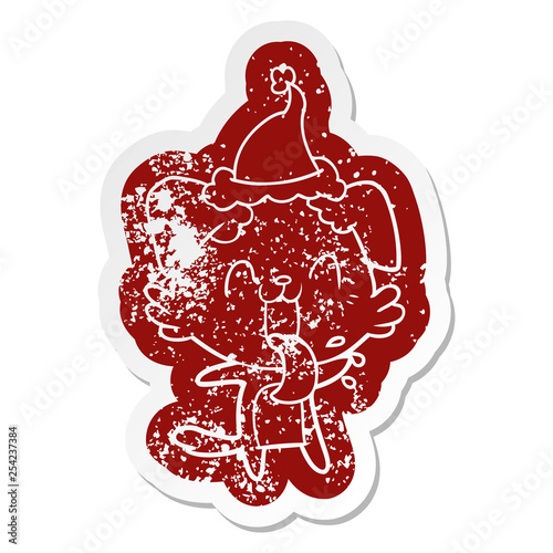 cartoon distressed sticker of a panting dog wearing santa hat