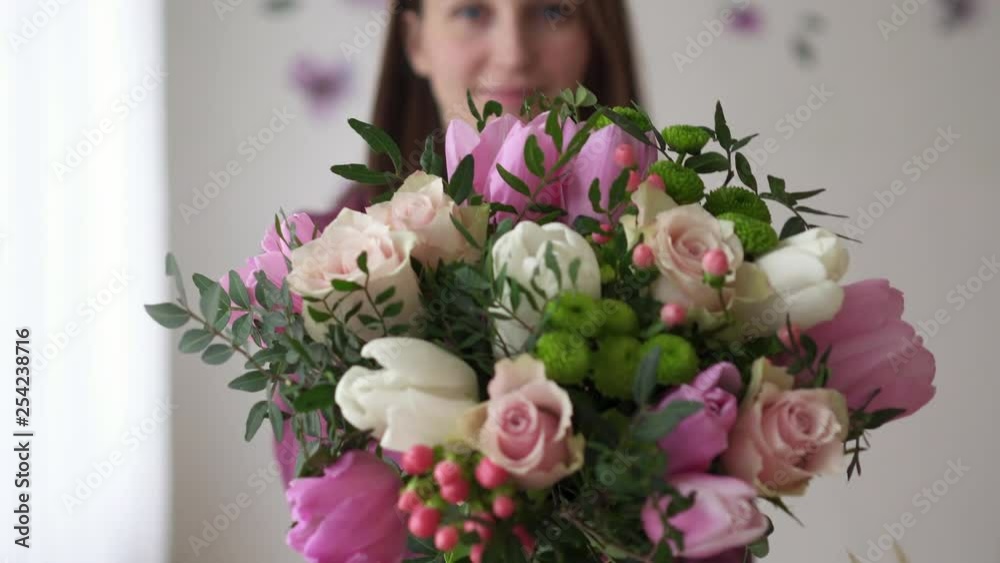 Portrait of florist woman with bouquet made by her Portrait of florist woman with bouquet made by her