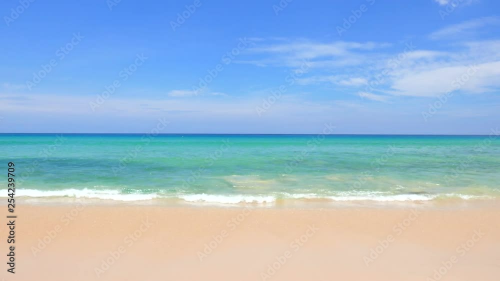 Clear waves crashing on the beach on a sunny day Clear waves crashing on the beach on a sunny day