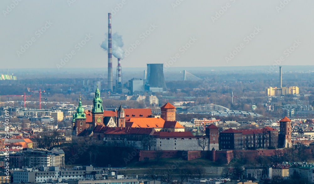 Obraz premium Wawel on the background of the heat and power plant, Krakow, Poland