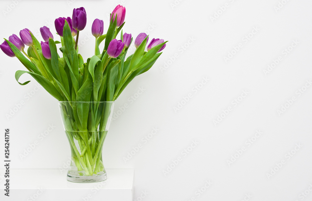 Fresh tulips on a white shelf home decoration Fresh tulips on a white shelf home decoration