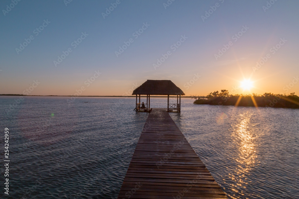 Sunrise, meditation in the lagoon of the seven colors, in Bacalar, Quintana Roo, Mexico.