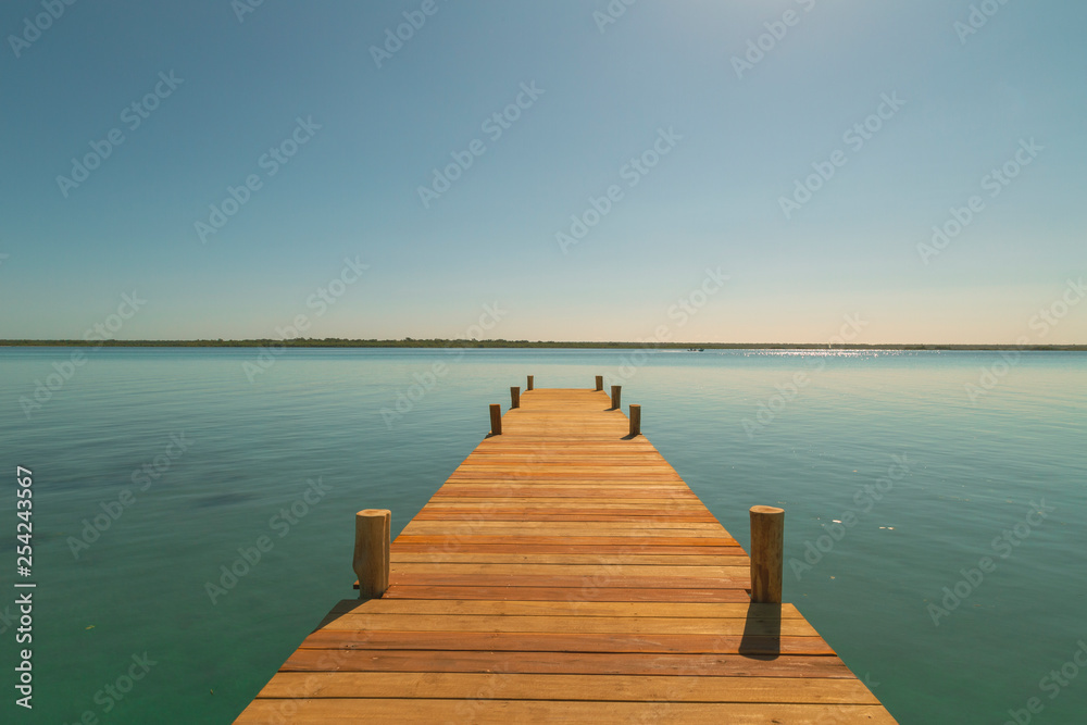 Sunset in the wooden harbor in summer,Bacalar,Quintana Roo, Mexico.