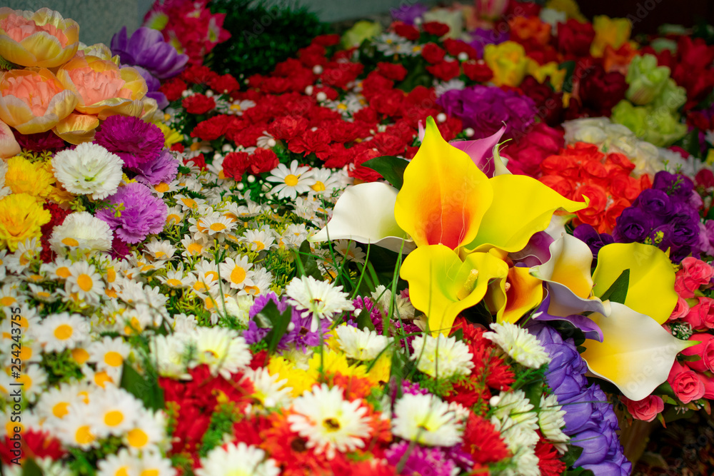 a bouquet of a mixture of different colors of artificial carnations, for decoration a bouquet of a mixture of different colors of artificial carnations, for decoration