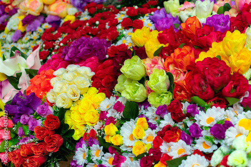 a bouquet of a mixture of different colors of artificial carnations, for decoration