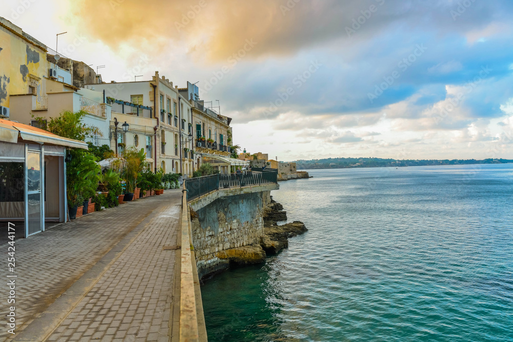 Street along the sea in the sicilian island Ortigia in Syracuse, Sicily, Italy