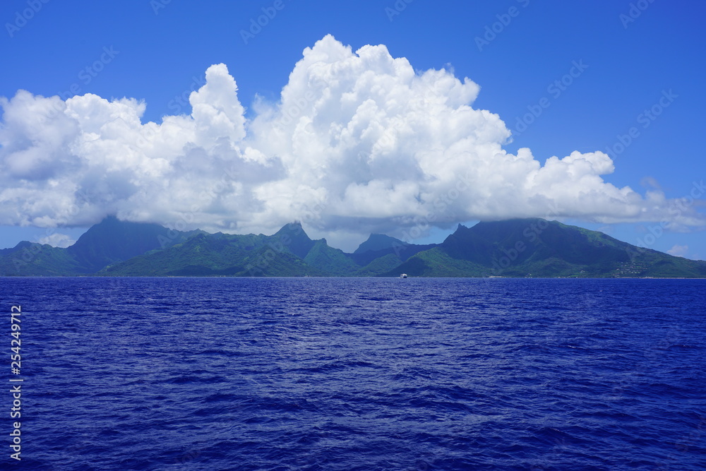Water view of the island and lagoon of Moorea near Tahiti in French Polynesia, South Pacific