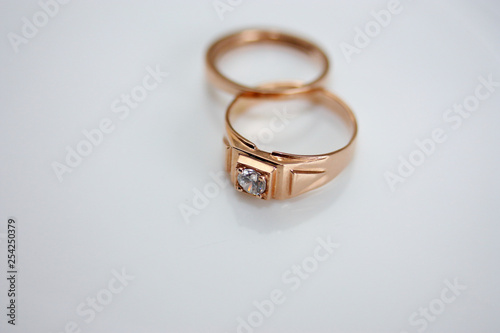 Wedding rings of the bride and groom on a white background.