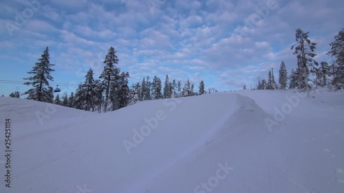 A Video of a jump over a small kicker in the Southpark in Levi Ski Resort, Finland. photo