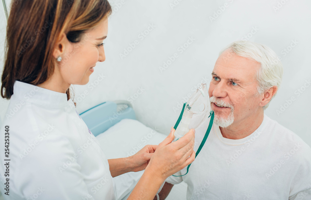 Senior man preparing to procedure inhalation at hospital Senior man preparing to procedure inhalation at hospital