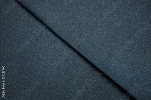 Dark blue textile sample. Fabric texture background concept.