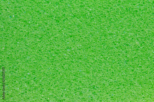 Sponge texture background. Close-up of green bath sponge texture with porous structure for background. Macro.