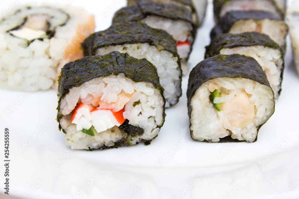 Japanese cuisine, rice sushi and fish - closeup Japanese cuisine, rice sushi and fish - closeup
