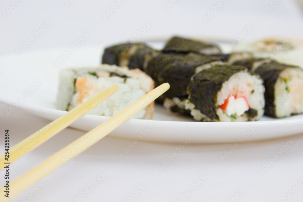 Japanese cuisine, rice sushi and fish - closeup Japanese cuisine, rice sushi and fish - closeup