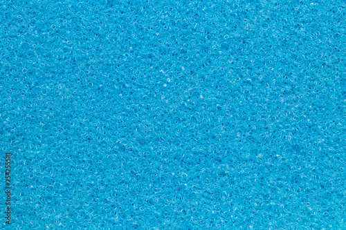 Sponge texture background. Close-up of blue bath sponge texture with porous structure for background. Macro. photo