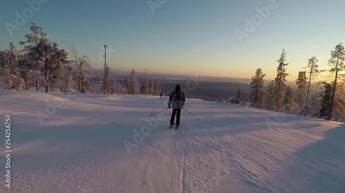 Video of a skier doing some tricks over the park elements of the south park in Levi, Finland. photo