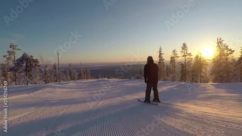 Video of a skier doing some tricks over the park elements of the south park in Levi, Finland. photo
