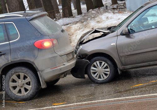 Collision of two cars on road in winter