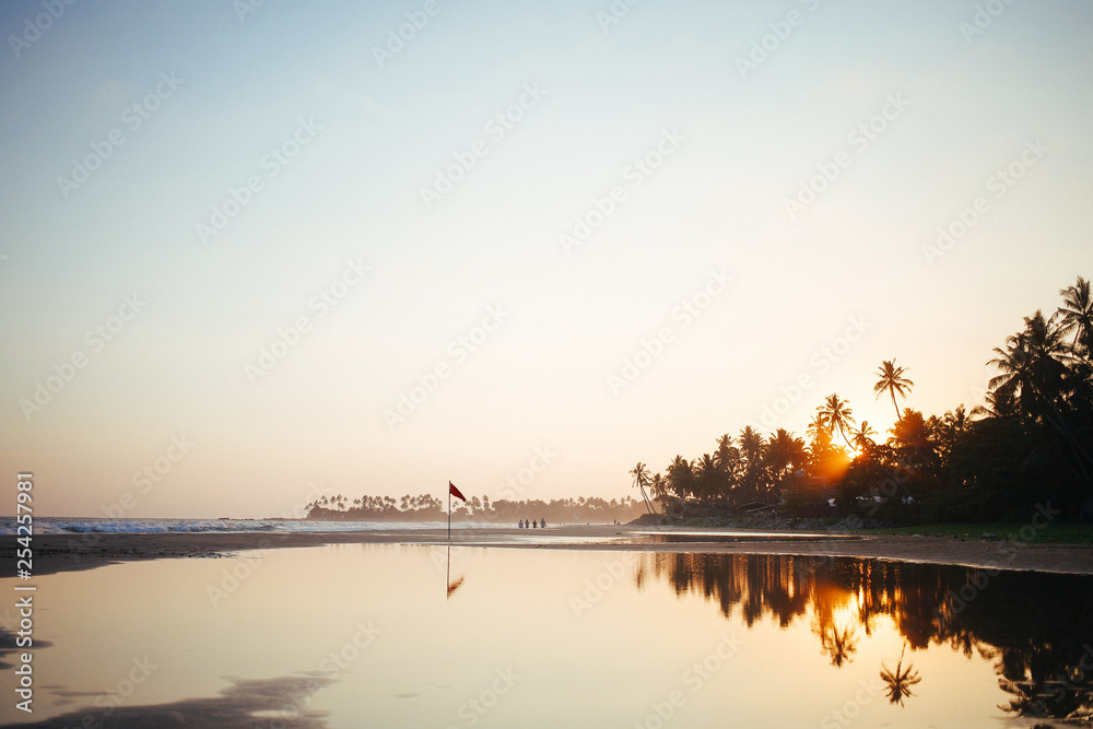 Beautiful beach and Indian ocean in Sri Lanka on sunset Beautiful beach and Indian ocean in Sri Lanka on sunset