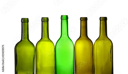 Empty green glass wine bottles isolated on white