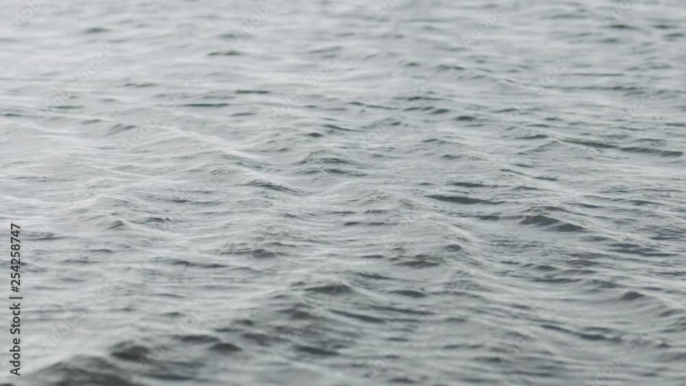 Slow motion ripple waves on sea surface on a windy day Slow motion ripple waves on sea surface on a windy day