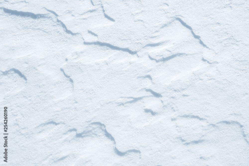 Obraz premium Fresh snow background texture. Winter background with snowflakes and snow mounds. Snow lumps.