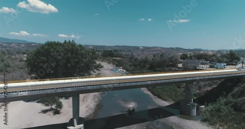 Aerial shot of a bridge and a river in Badiraguato, Sinaloa photo