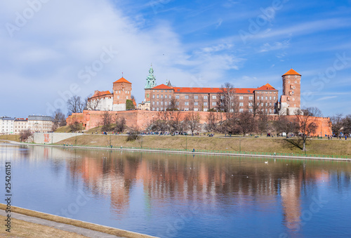 Wawel Royal Castle famous landmark in Krakow Poland. Picturesque landscape on coast river Vistula.  Blue sky and cloud. February 23, 2019. © cubrick