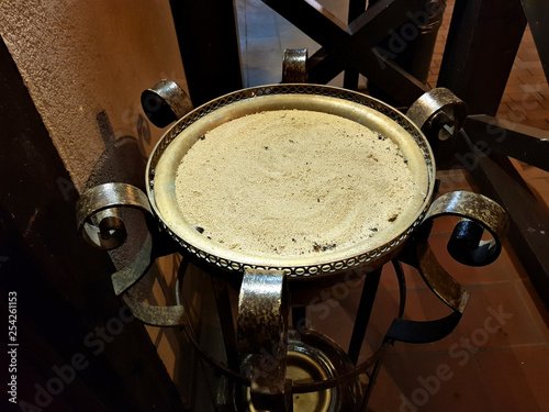 Large metal outdoor ashtray with sand