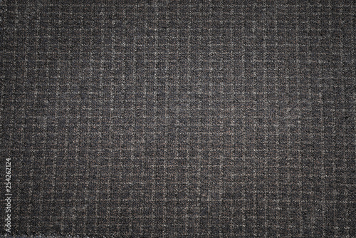 Black fabric texture background. Dark woven clothing material.