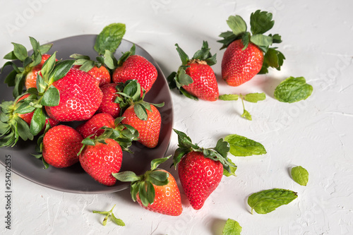 Heap of fresh strawberries on wooden table