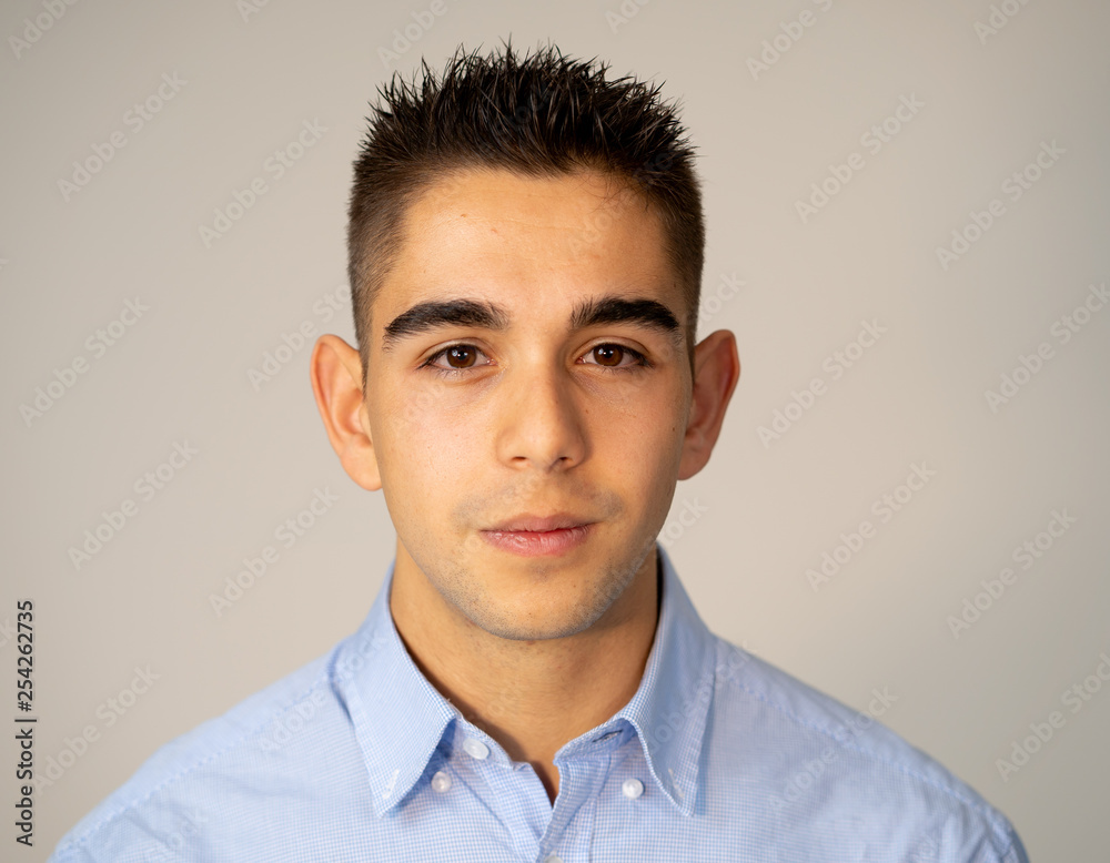 Portrait of handsome young man in neutral poker facial expressions and human emotions Portrait of handsome young man in neutral poker facial expressions and human emotions